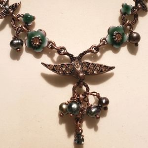 Swallows and flowers necklace.